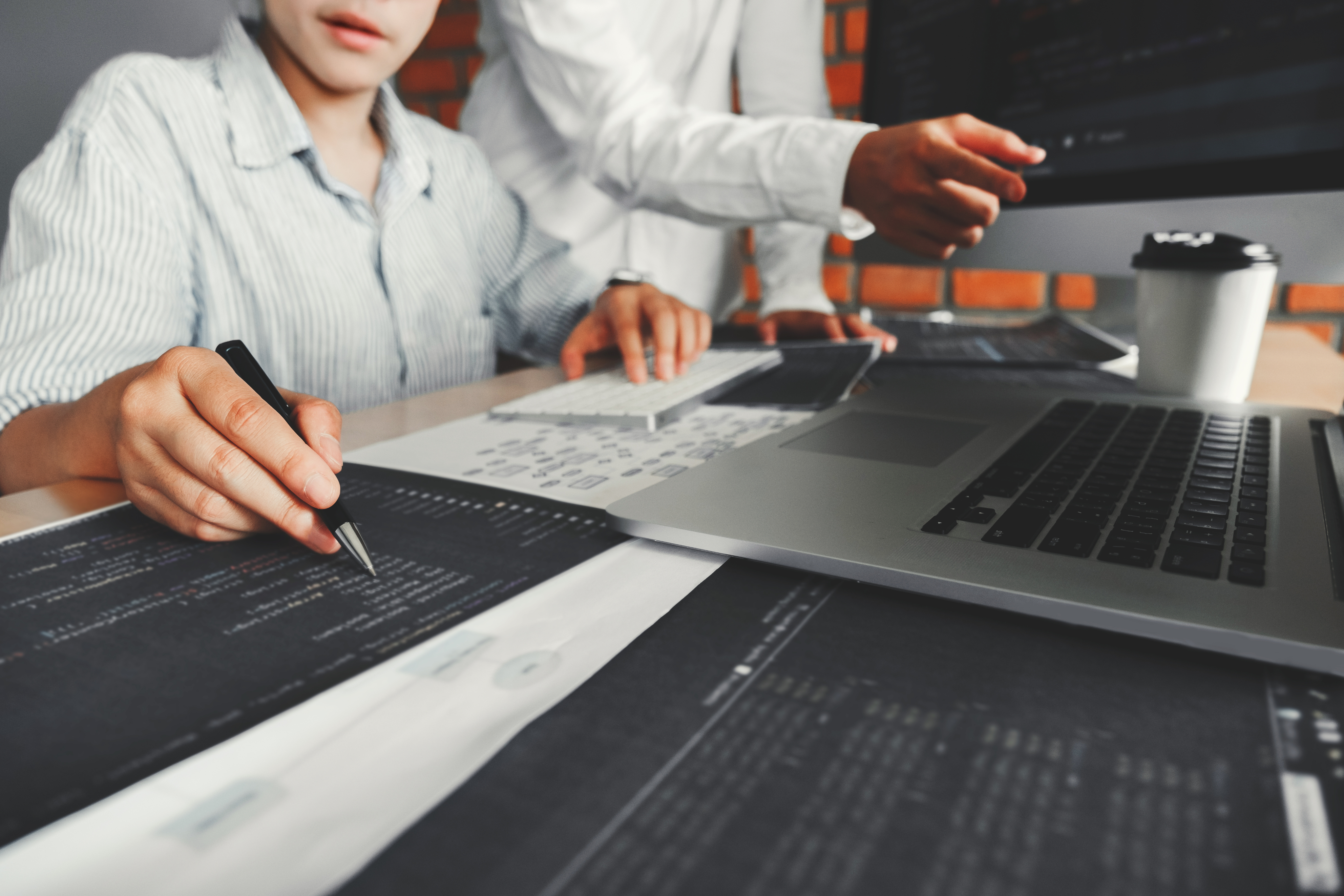 Team planning digital strategy at a desk