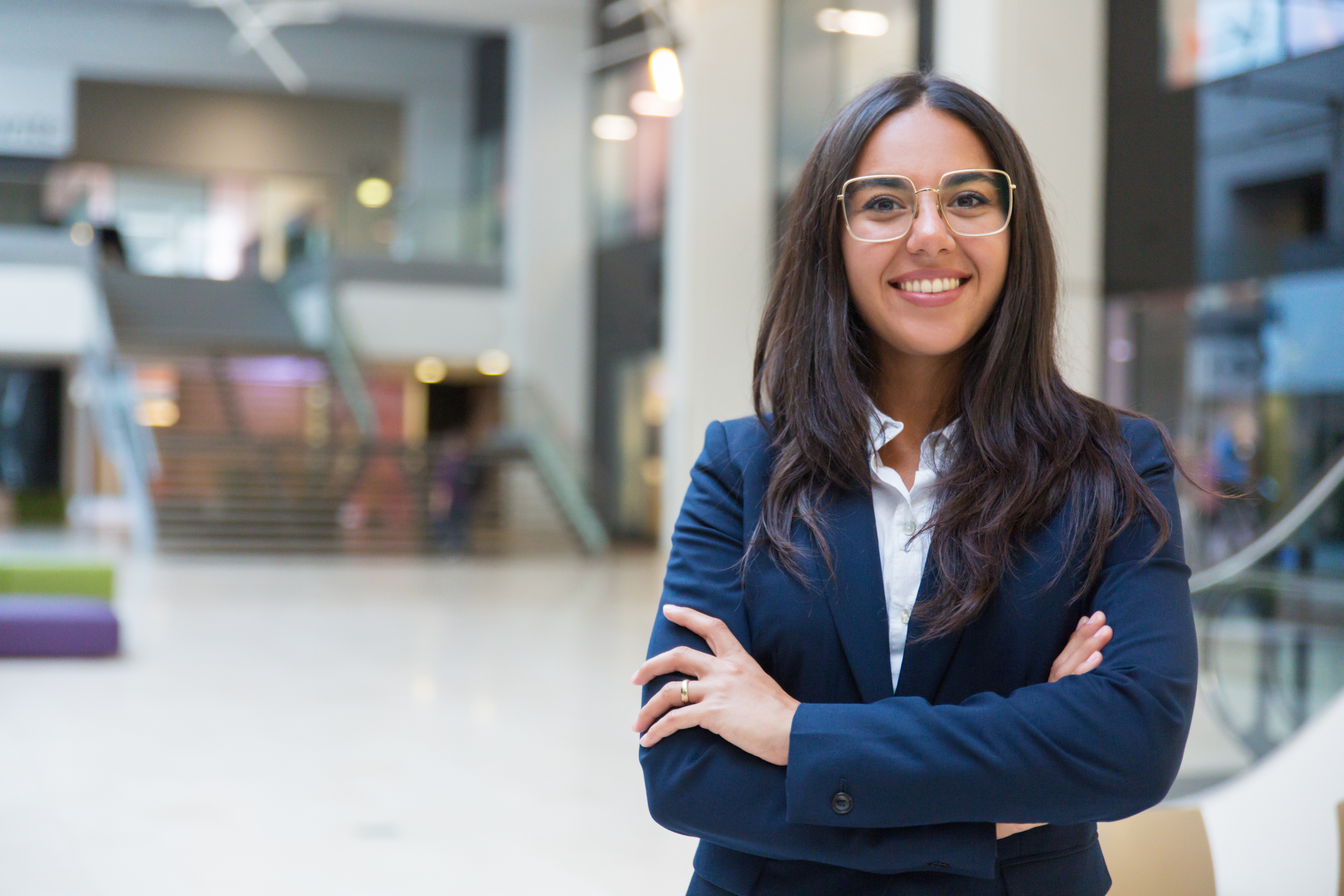 Smiling professional standing in a modern office