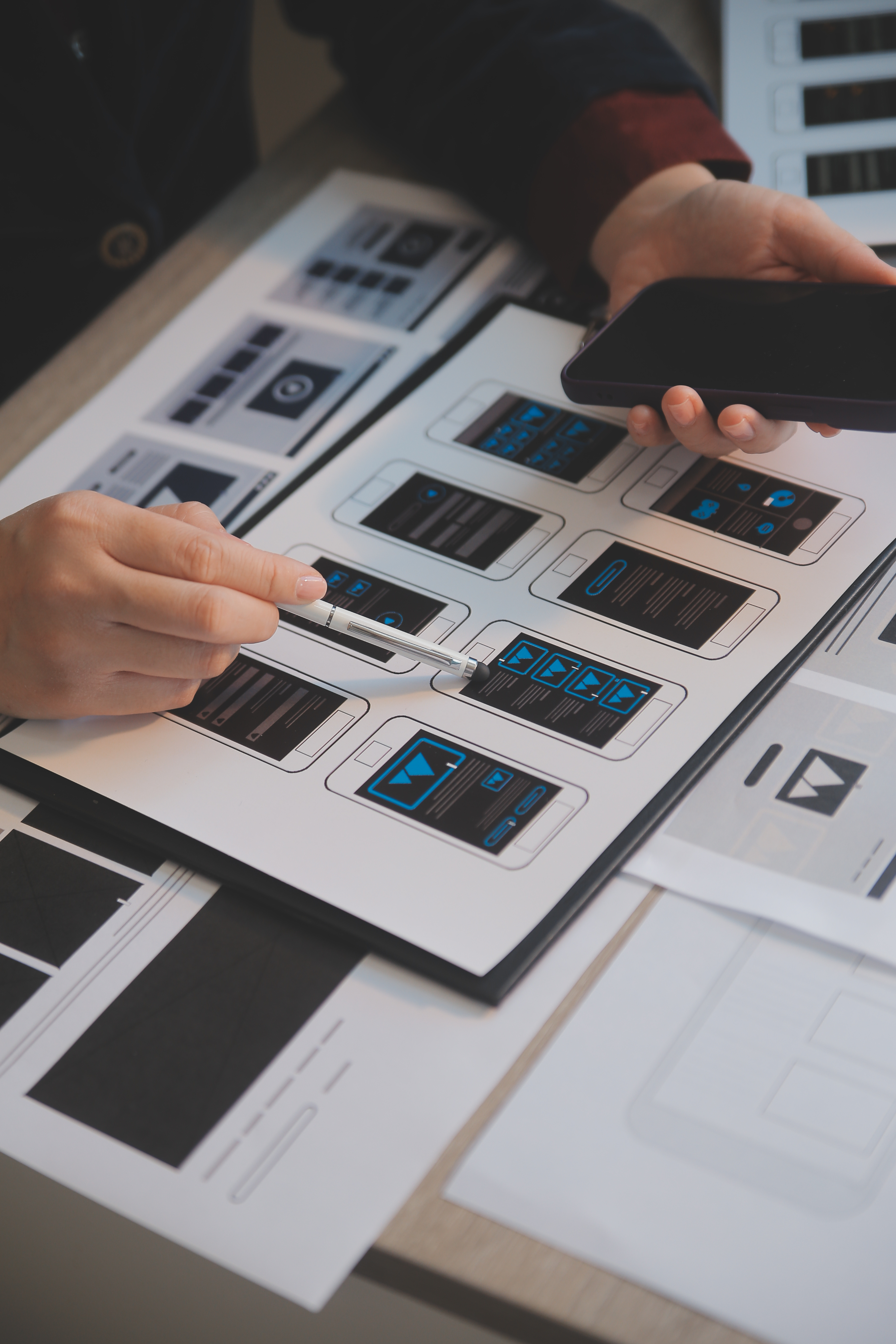 Design team reviewing product interfaces