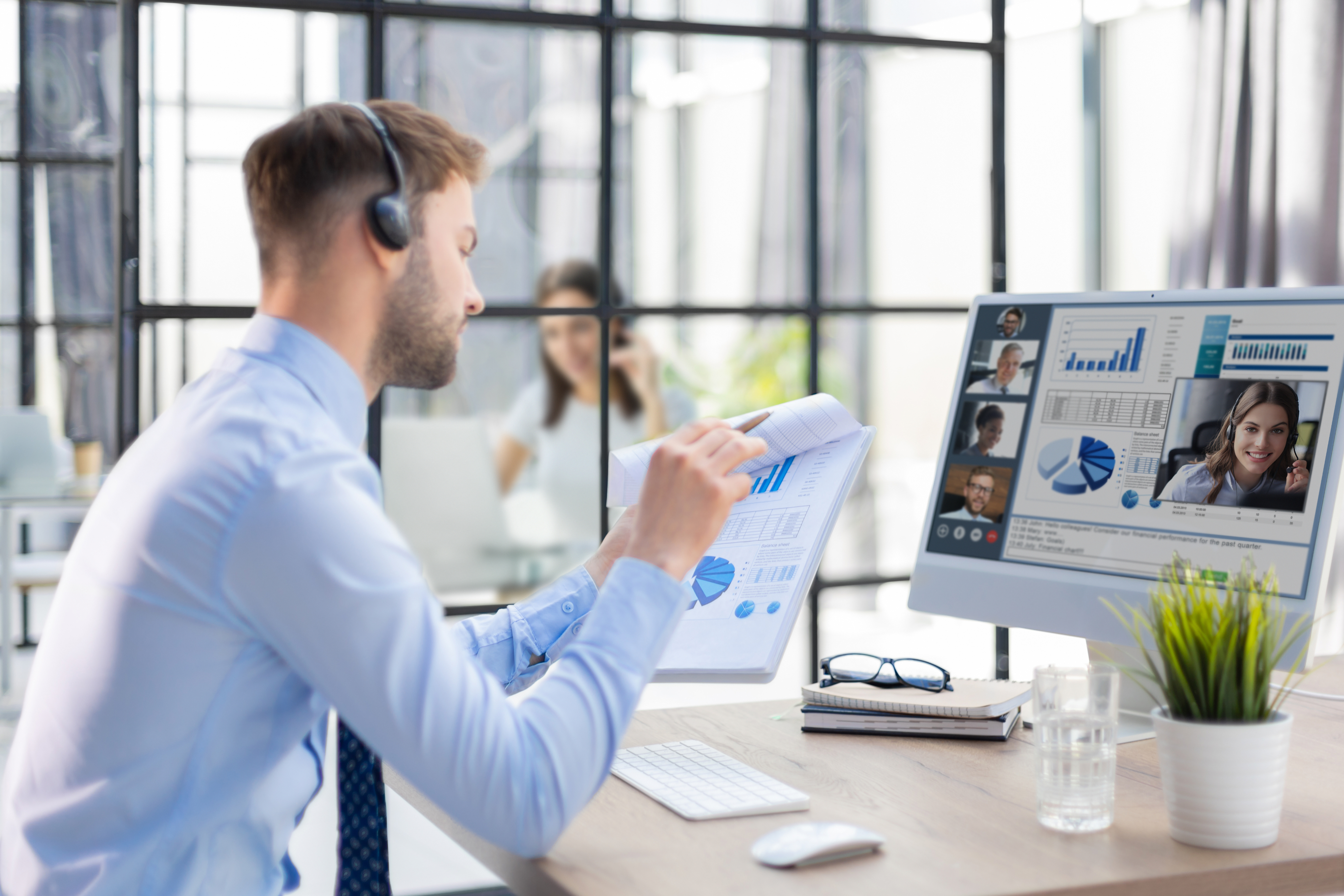 Remote assistant reviewing analytics on a desktop monitor
